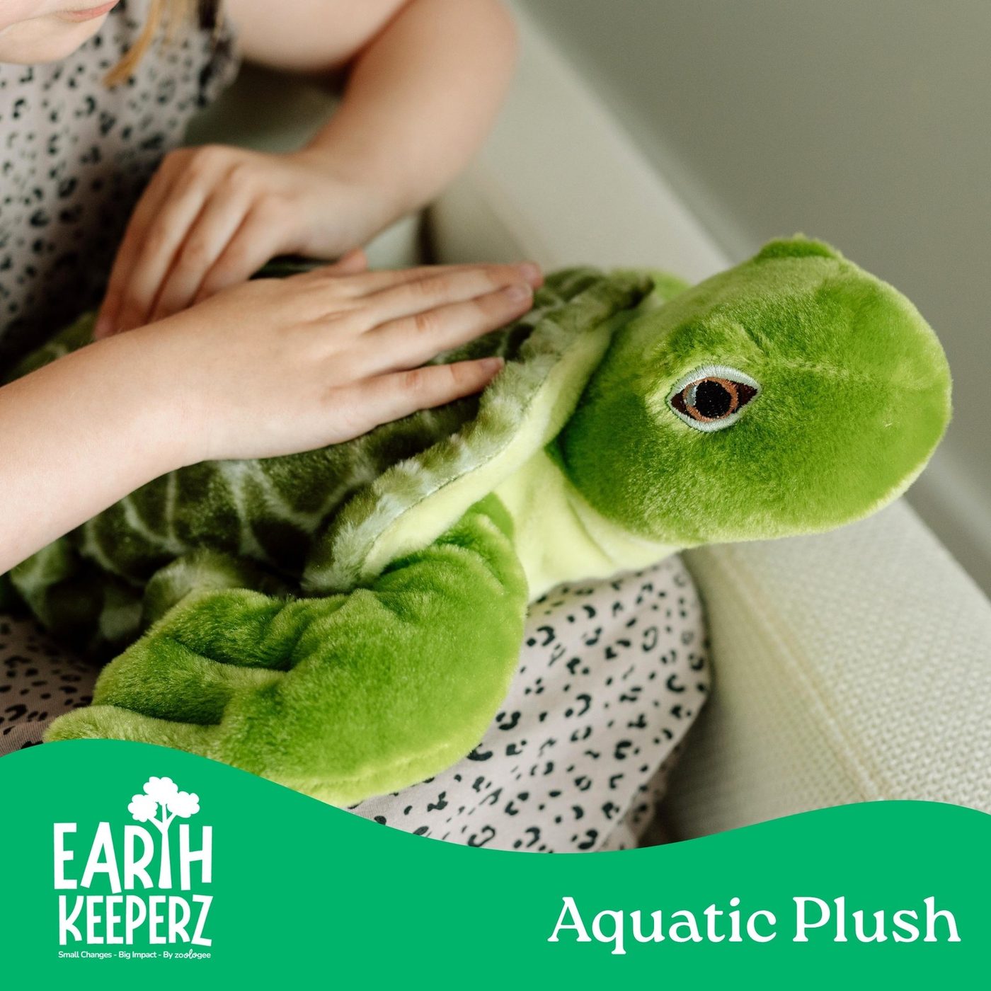 An Earth Keeperz aquatic sea turtle plush toy held in two hands